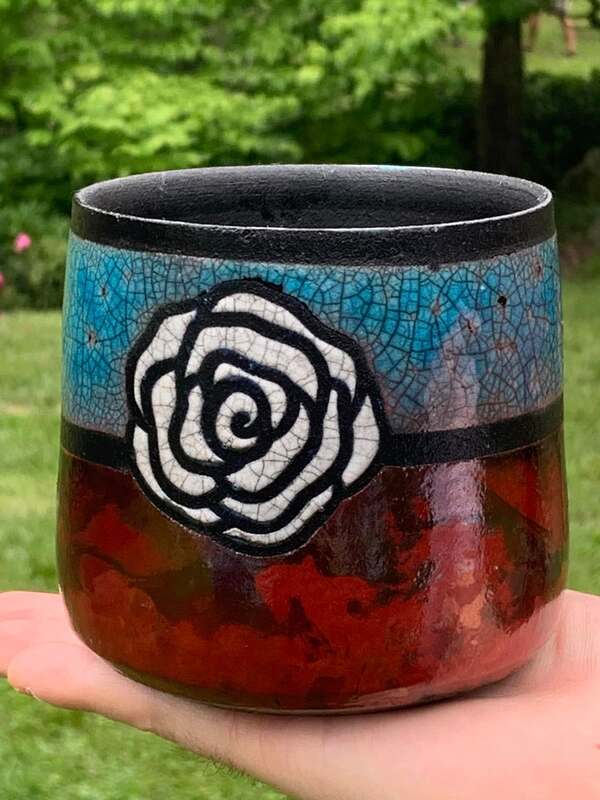 Handmade raku pottery vase with rose design at House of Clay in Overland Park